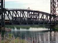 NS 445 departing Dain and crossing over Bridge 17 over the old Welland Canal heading to Feeder South for Fort Erie and onto Buffalo back in 1995.