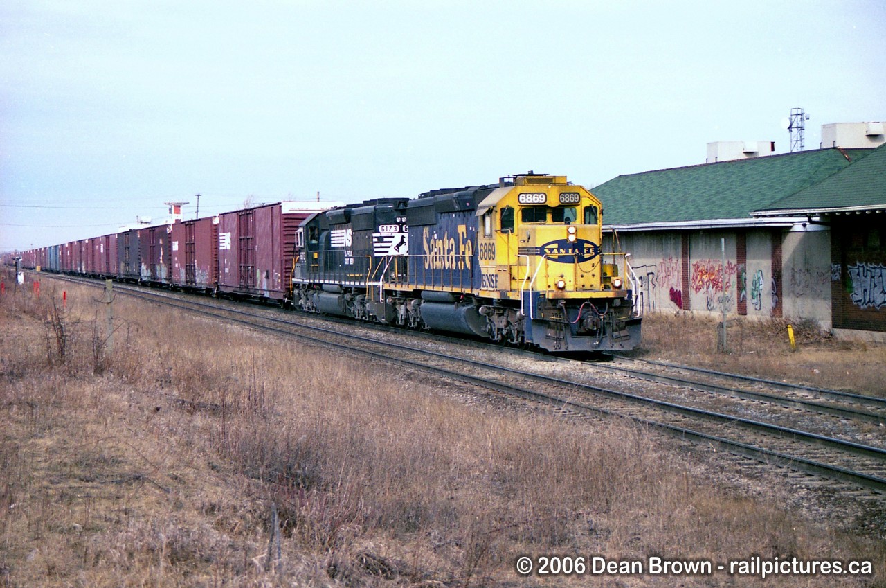 NS 328 with BNSF SD40-2 6869 and NS SD40-2 6123 through St. Catharines on the CN Grimsby Sub back in 2006.