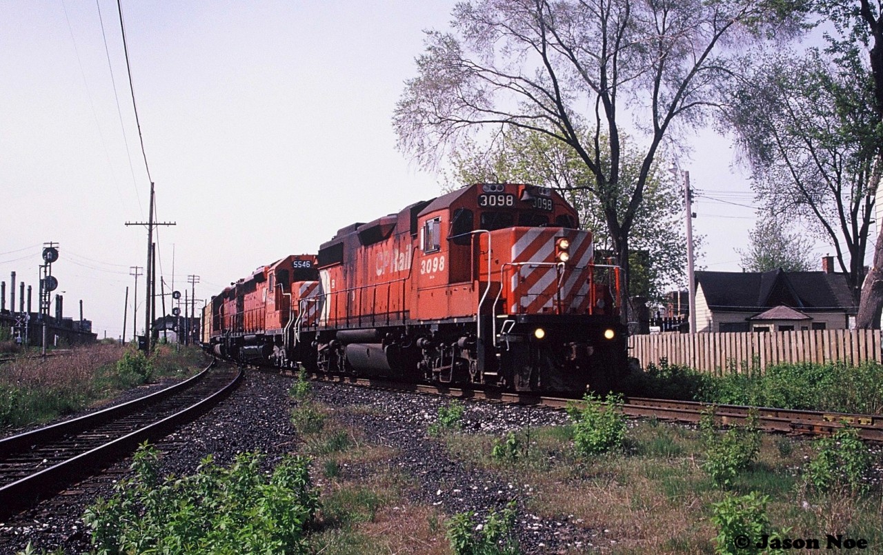 During a spring afternoon, a CP southbound is about to curve-off the MacTier Subdivision at West Toronto, Ontario with GP38-2 3098, SD40 5546 and another SD40.