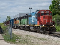 CN L542 makes a reverse move to drop 2 flat cars of rail at PNR Railworks in Guelph.  The power on this day was GTW 6420, BNSF 2926, BNSF 2090 which made for a very colourful consist.