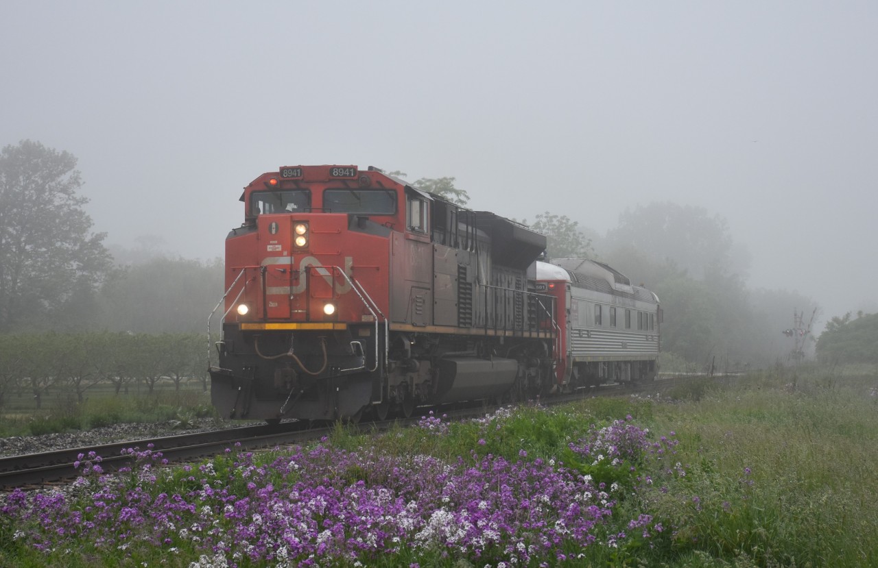 The morning was sufficiently foggy enough to stay at home but I thought, "what the heck". Out I went.  After AMTK 108 (50th Ann) went east the light soon went back to green as I was expecting the morning #421.  Instead, I get this.
Bit of a surprise, CN 8941 with the Evaluation Budd in tow. First time I have seen this car not under its' own power.