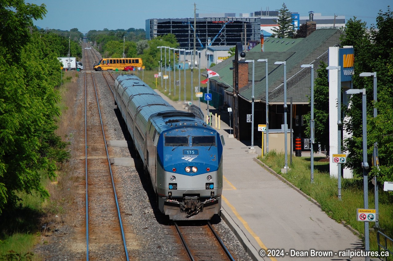 VIA 97 approaching St. Catharines station, is so overgrown here.