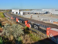 <br>
<br>
  The final day(s) at the Hopkins St overpass....
<br>
<br>
   Construction of the GO East Rail Maintenance Facility progresses, 
<br>
<br>
  CN 271, with CN  8889 / 2191 / 5442  combo:  SD70M-2 /  Dash 8-40 CW  / SD60  on the south service track lifting Oshawa autoracks,
<br>
<br>
  From the since removed Hopkins St overpass, Whitby, October 12, 2016 digital by S.Danko
<br>
<br>
   Noteworthy: 
<br>
<br>
Subsequently, the GM Oshawa plant(s) ceased production December 2019. And as of November 2021 GM Oshawa restarted 1500 and 2500 series pick up  truck production.
<br>
<br>
More
<br>
<br>
     <a href="http://www.railpictures.ca/?attachment_id=  23828 "> CN 271   </a>
<br>
<br>
sdfourty
 

