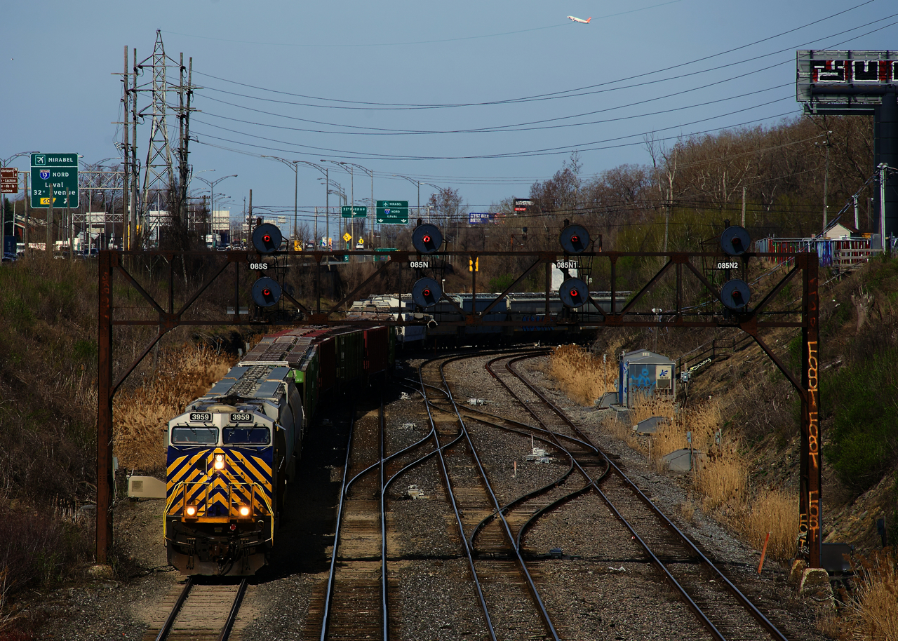 After setting cars off there, CN 322 is leaving Taschereau Yard.