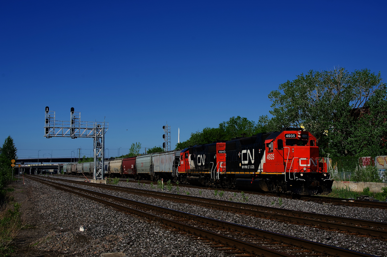 CN 500 is leaving Track 29 with eleven grain cars.