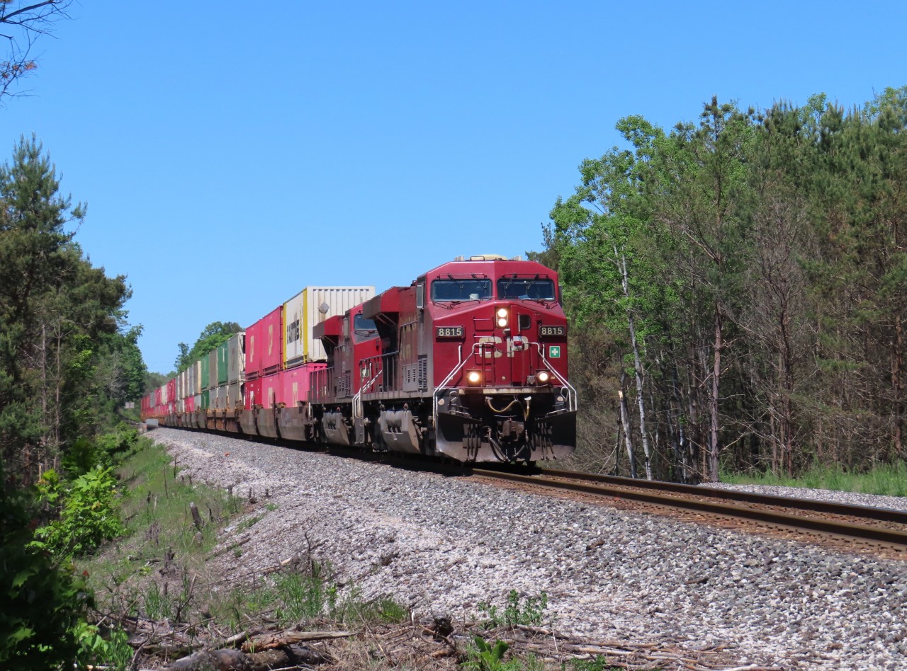 With two units on the front and a KCS unit on the rear, a long intermodal train crosses the Willow creek trestle just north of Midhurst.