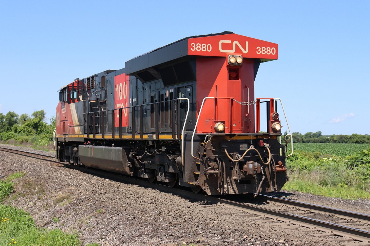 CN ES44DC 3880 heads east out of Sarnia light power on the Strathroy subdivision to rescue a train tied down at Kerwood.