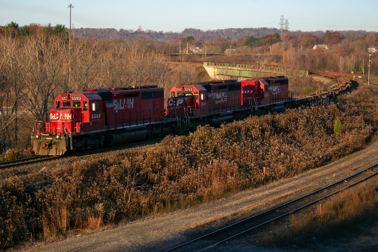 Hard to believe that this was taken almost 20 years ago…  CP 418 descends the escarpment into Hamilton with StL&H 5593, CP 5743 and high nose CP 5477.  Shortly after the power operated by, NS 328 entered the cow path with a pair of BNSF GEs. For a video of this check out the YouTube link in the comment section.