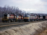 With almost entirely MLW power in the scene, a pair of westbound extras meet at First Line.  Extra CP 8027 works the yard at Guelph Junction while extra CP 4050 flies past on the main.<br><br><i>Scan and editing by Jacob Patterson.</i>