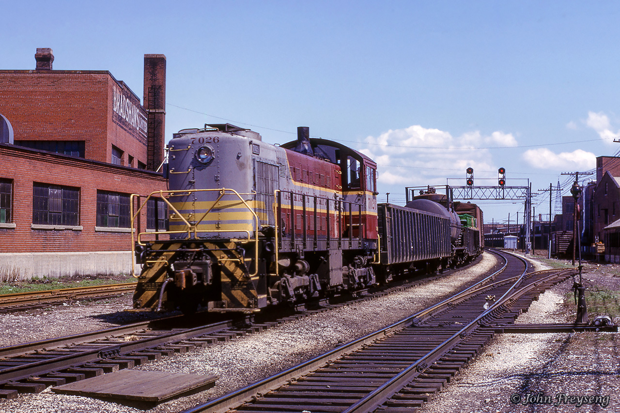 CPR S2 7026 heads up a westbound wayfreight along the North Toronto Sub towards Lambton Yard, having just cleared the diamond at Davenport with the CN Newmarket Sub.Scan and editing by Jacob Patterson.