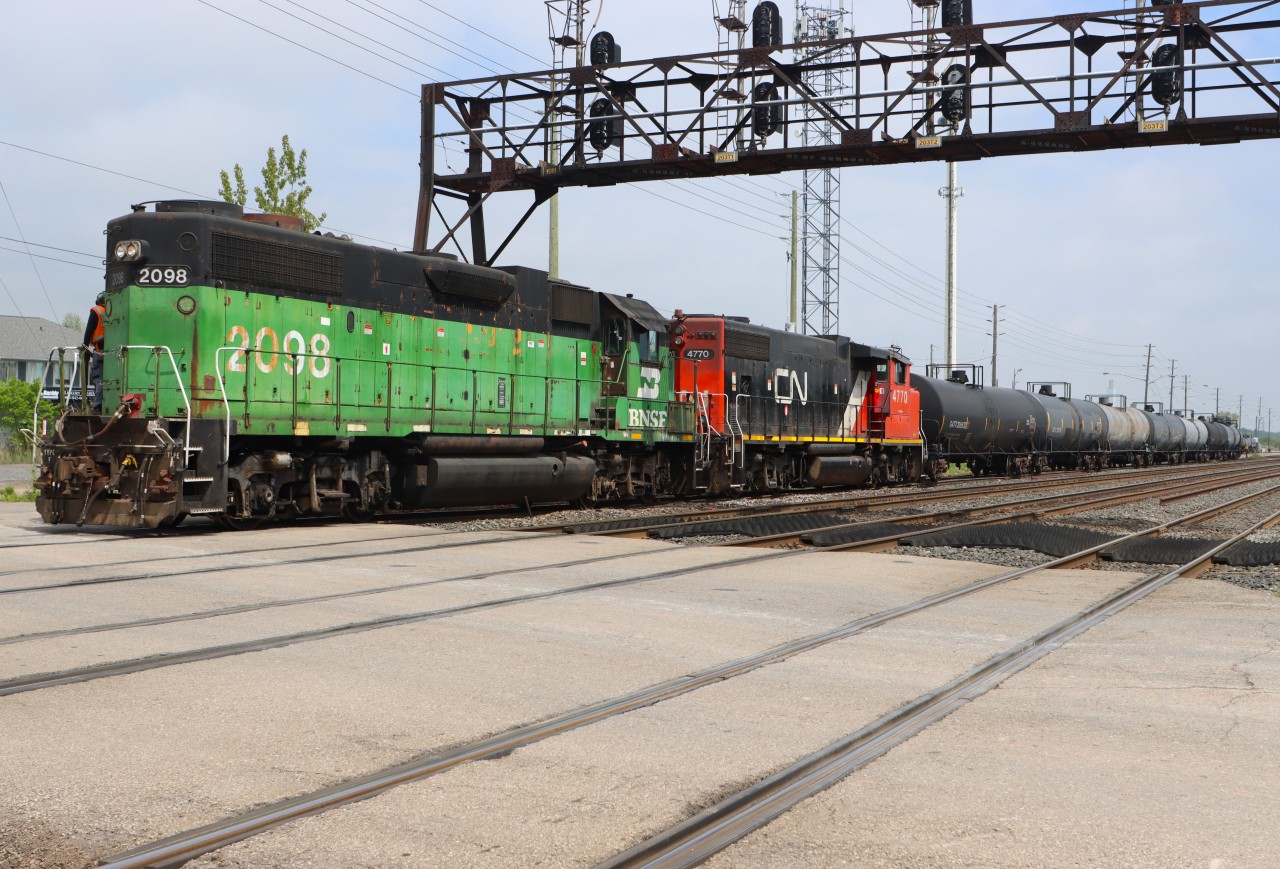 BNSF 2098 is the trailing unit for the Oakville Beltpak Assignment as they push into Oakville Yard with a solid cut of tanks.