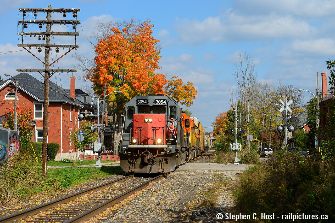 A few folks who contribute to this site were asking about GEXR 432/1 when I was with them the other day, and I've become all nostalgic. Plenty of stories are already posted here by many photographers and even folks who worked for them. After getting all nostalgic for what was a pretty (1) |  damn fine(2) train to see, listen (click for sound) and photograph,  with some pretty cool stuff to photograph over the years, I've pulled out a GEXR shot from the waning months of their tenure on the Guelph sub. Most of these folks moved over to CN and many are still here, while a few stuck around with GEXR out of Goderich and now either work the Goderich or Guelph Junction assignments since they expanded to GJR. The fine folks of the GEXR have really spread out and their influence on railroading in South Western Ontario shouldn't be ignored - remember GEXR was Ontario's first modern era shortline spinoff and one of the first in the country back in 1992. These folks come from a line of people who wrote the book on how shortlines should run in the modern era.
So without further ado here's a spot Metrolinx continues to ruin by putting up fencing and other garbage. Also noted is the still 20 cylinder SD45 GEXR 3054 Tunnel Motor which is now at LTEX and languishing, but Conductor Kelly in the photo as well as many of the GEXR craft are still working hard to serve our communities. A thankless job, but thanks guys :)