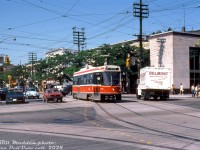 A nice sunny afternoon along College Street finds TTC CLRV 4080 operating on the 506 College streetcar route, heading east in traffic on College at Spadina Avenue as people go about their day. At the time, the CLRV's were still in their infancy, and still retained their front and rear couplers (but they never ran MU'ed in revenue service).
<br><br>
<i>William (Bill) Madden photo, Dan Dell'Unto collection slide.</i>
