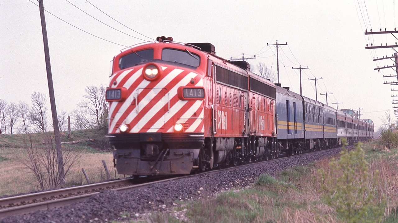 Early VIA and the daily FAST transcontinentals.


  Enroute to Barrie and beyond, one-two hundred fifty of a second is insufficient to freeze capture ex CP Rail FP-9A #1413. 


  Daily FAST  VIA Rail #1 on the CN Newmarket, with only weeks remaining *, May 12, 1979 Kodachrome by S.Danko


Interesting


  Early VIA Rail maintained CP Rail's daily FAST service, 

 albeit slowed by the re-routing onto CN Newmarket (Union to CN Boyne to CP Rail Reynolds) 

and the divergent route into Winnipeg (to access the ex CNorR Winnipeg station),


  VIA's  April 1979 Canadian: Toronto to Banff,  50:10 (two nights) and  67:35 to Vancouver (three nights).   


  [ CP Rail circa 1975 The Canadian  timekeeping was FAST, with first generation aging F's,  47:30 Toronto to Banff and  64:55 to Vancouver ].  





   Noteworthy *  The June 17, 1979 timetable: 

    re-routed the daily VIA #1 & 2  CANADIAN exclusively onto CP RAIL to /from Montreal.


    re- routed daily VIA trains  #3 & 4  SUPER CONTINENTAL exclusively on CN to /from Toronto. 


   VIA trains # 1 & 2, # 3 & 4: The June  17 1979 re-routings were only in place until June 1982  when the SUPER CONTINENTAL trains # 3 & 4 disappeared completely, replaced by 10 regional daily / tri weekly trains.


sdfourty