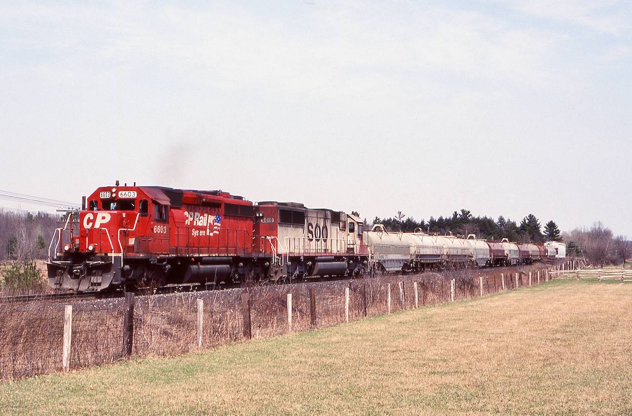 Sometimes train 525’s power was a bit interesting. Usually SD40’s so catching a SOO SD60 was a bit rare, although I found the former SOO SD40 more interesting this day. Here the train races westbound after stopping at Guelph Junction.