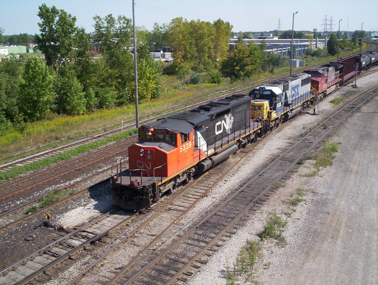 CN SD40-2W 5339 leads CSX 8526 and BNSF 786 through the yard at Sarnia, Ontario with a westbound freight, back in those days of foreign power any and all combinations could be seen.