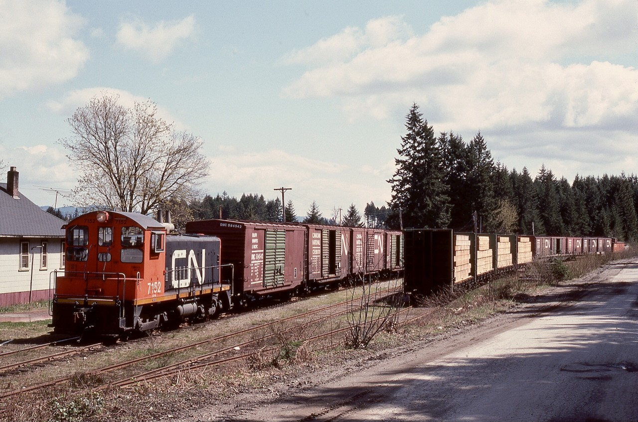 On Vancouver Island, after several years with G12 units CN 991 and 992, CN tried SW8 units at Deerholme for the runs to Youbou and down to the barge slip at Cowichan Bay.  First up was CN 7152, seen here on Tuesday 1976-04-20 idling near the bunkhouse at Deerholme with a string of empties preparing for departure to Youbou.

Various single SW8s lasted at Deerholme until replaced by A-1-A-trucked GMD-1s later in 1976, and the 1000s continued until the end of service there on 1988-03-30.