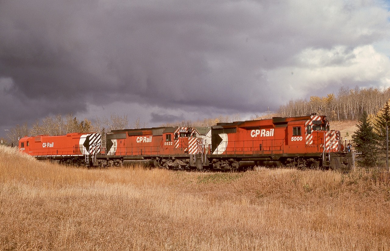 Venturing eastward from CP’s mostly GM west coast in 1976 and across the prairies to Manitoba provided many discoveries, among them a very clean MLW M-636, CP 4730, and consist switching at Minnedosa on Monday 1976-10-04.  A particular delight was the first CP GP30, 5000 itself, notable as nearly unique on CP’s roster as Empress of Agincourt CP 8924.

CP’s yard at Minnedosa was as a spur off the mainlines, presumably to take advantage of the level ground along the Little Saskatchewan River rather than being along the significant grades east and west of town.

In the early years of CP’s diesel shop in Port Coquitlam, 5000 and 5001 and numerous GP35s were assigned for maintenance and local service, so I had an opportunity to learn how they were an early step into solid-state electronics (silicon power diodes instead of selenium rectifier stacks, and used with AC reactors to control generator excitation, pretty heady stuff when new in 1963, but electrical dinosaurs compared to GP38ACs!) while still using first-generation magnetic switchgear which I knew from the newest fifteen GP9s.