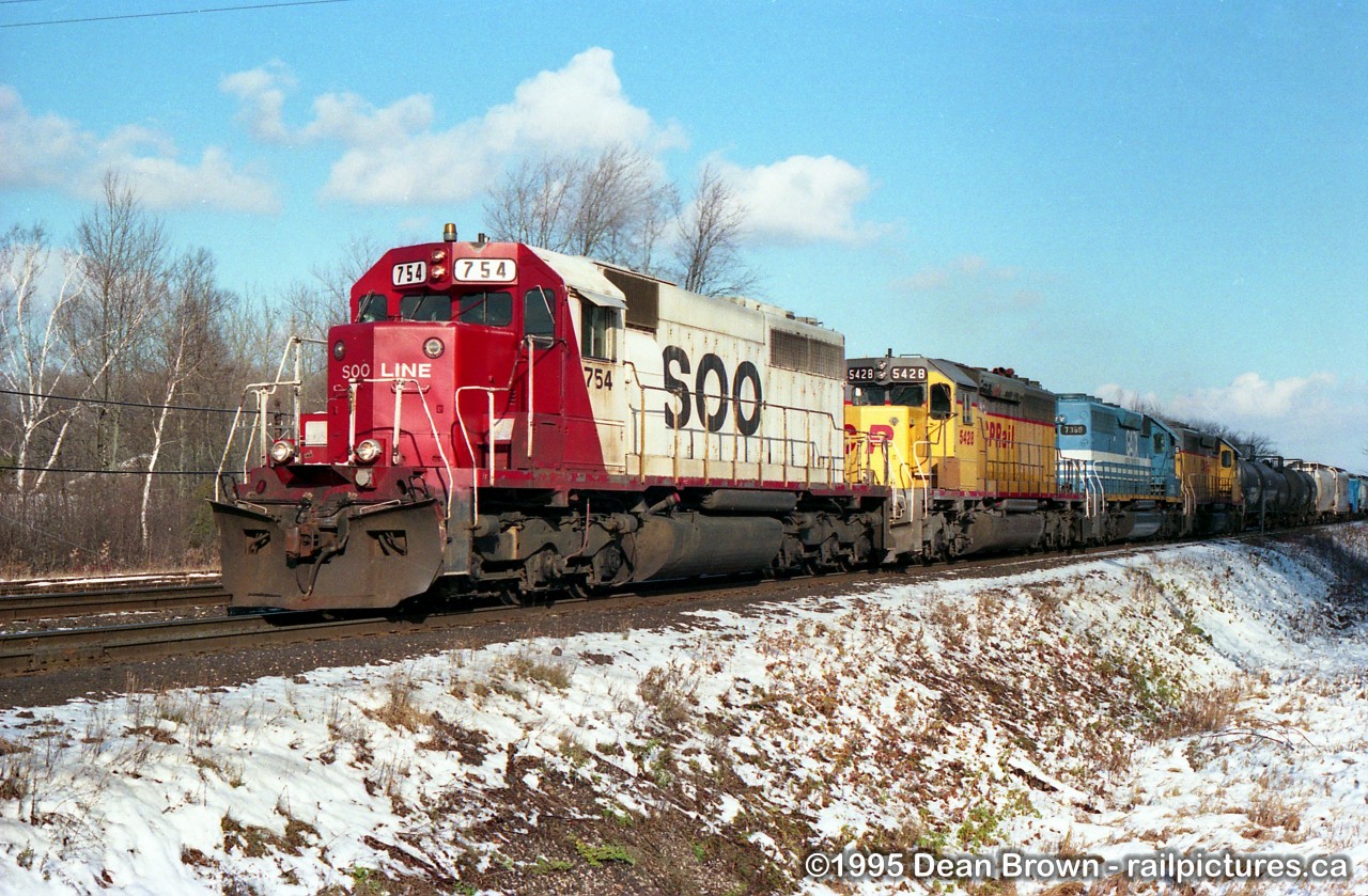 CP Westbound with S00 754 leads a nice colorful lashup at Guelph Jct East on the CP Galt Sub.