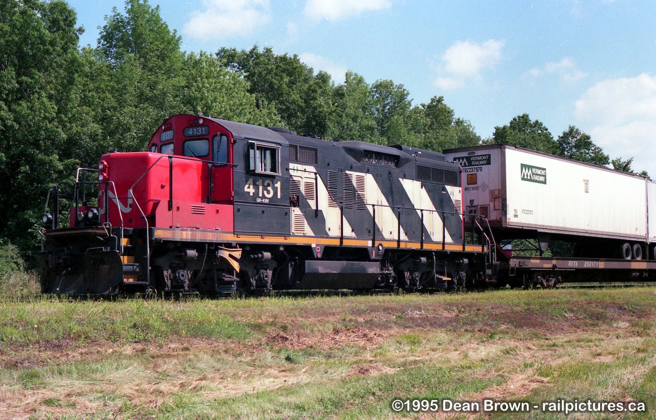 CN 105 with CN GP9RM 4131 parked at CN/NS Dain Intermodal Yard. This is a transfer that runs between Dain and Feeder Yard.