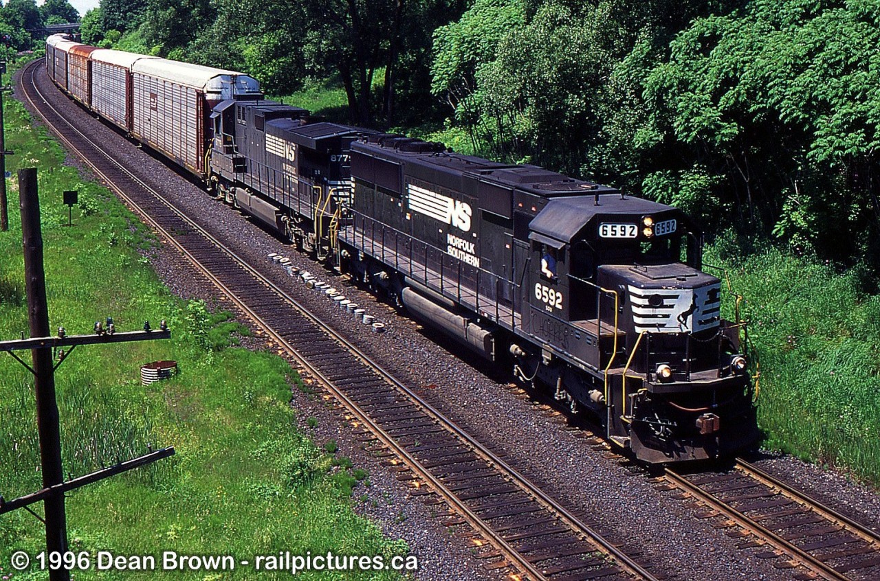 NS 6592 leads NS 328 through Copetown at Inksetter Rd. on the CN Dundas Sub.