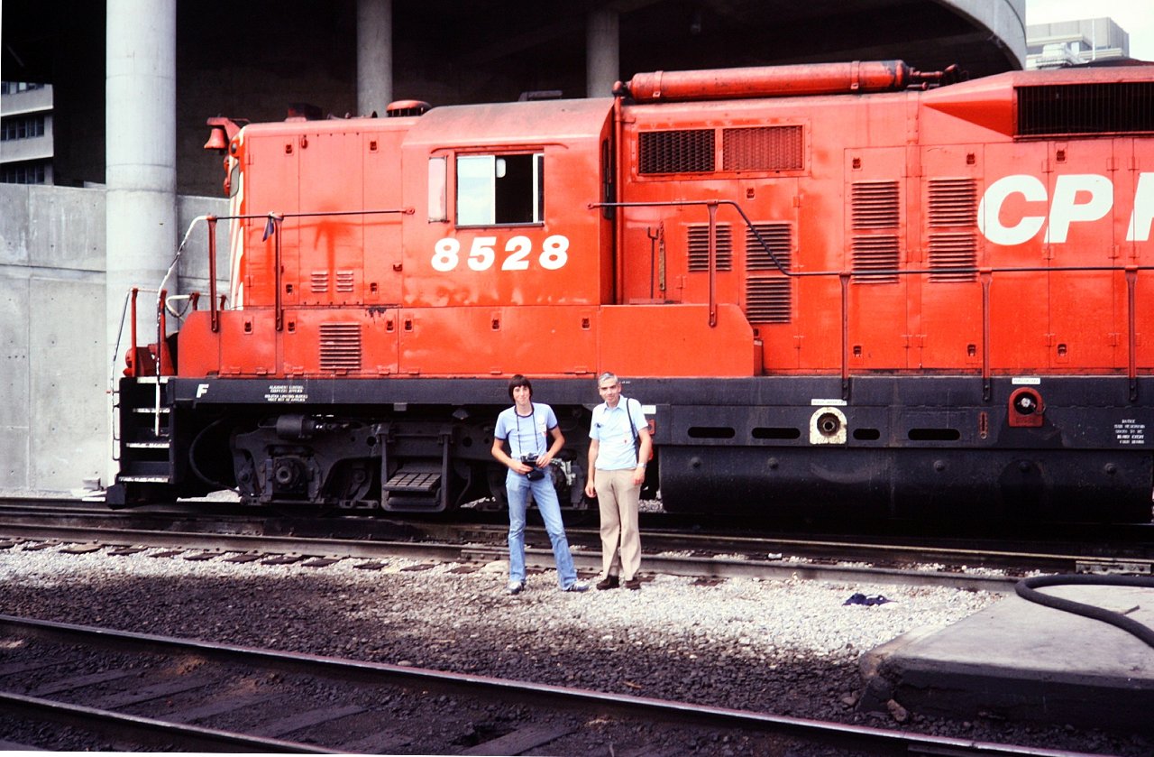 One for Fathers Day. Here I am in 1979 as a skinny 16 year old beside my Dad at the Calgary station in front of a boiler equipped GP-9 parked as protection power.

My Dad grew up in two houses beside the tracks in Peterborough and later an apartment nearby the line to Lindsay, so he was always a railfan. He left the photography work to my mother and brother as cameras seemed to spite him.

This was the last big trip we did before my brother and I headed out on our own into the world. All these years later I still think it was one of our best.