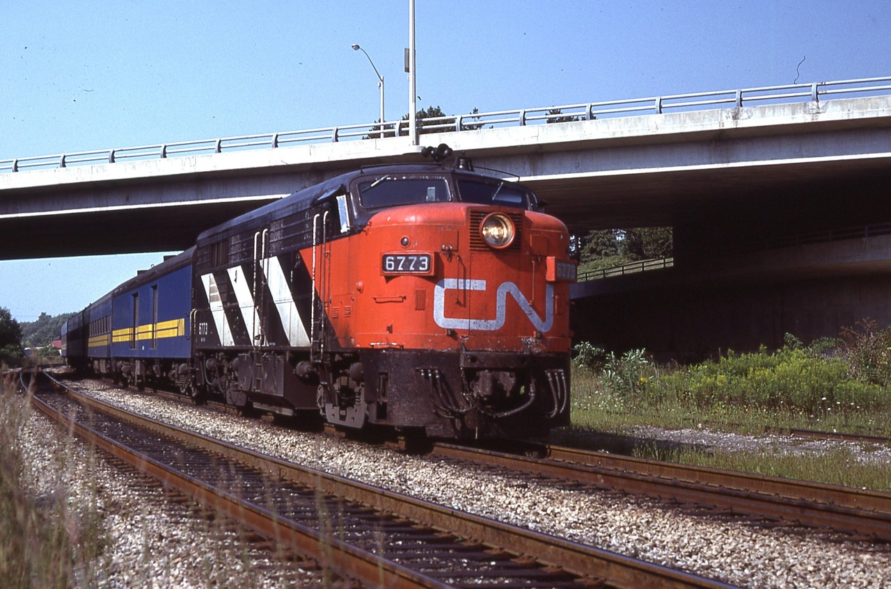 It is the early years of VIA, as one can see by the blue/yellow baggage car behind CN 6773. This train was recorded as it came up to Bayview Jct on it's eastward journey. Looking at the sun angle I am wondering if this the old afternoon #74. According to the CTG this locomotive now resides in Williams, AZ, home of the Grand Canyon train. Nice to know it lives on.