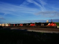 CN 121 heads west with four GEs up front.