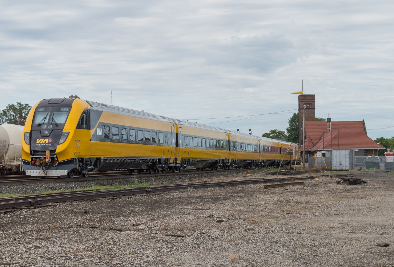 On June 25th, the latest Via Rail Siemens Trainset travelled through Southern Ontario on its way to MMC to be handed off by CN to Via.  This set is a one of scheme reminiscent of the Turbo Trains of the past.  It is seen here passing through Brantford on CN P276.