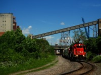 CN 500 is leaving the Port of Montreal with hoppers and baretables.