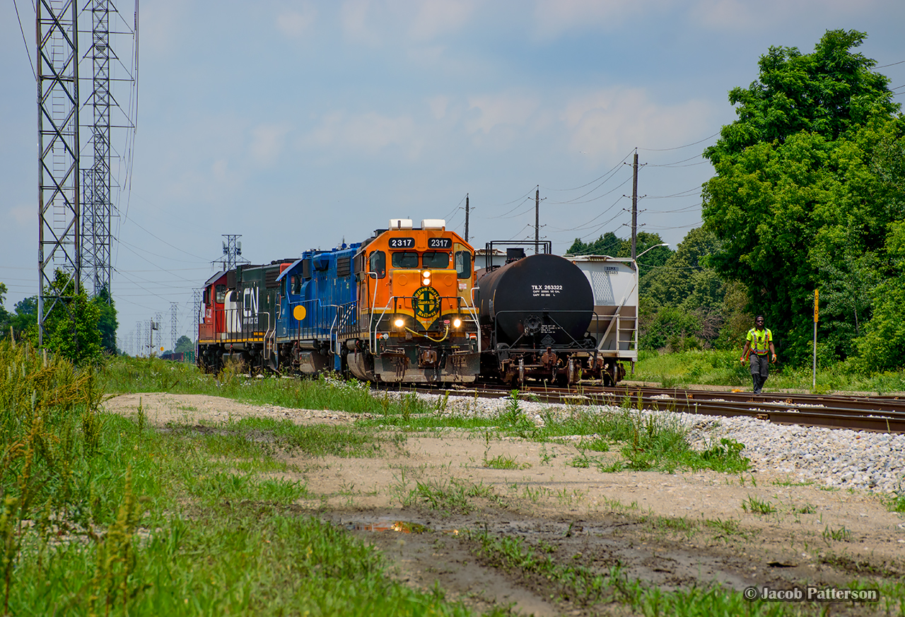 Derail is down, and power is lined off the wye as CN L542 pulls down to the south end of XT99 to lift 13 cars for Kitchener.  Everywhere on the Guelph Junction Railway is plugged with cars at the moment, and CN arrived with 34 cars today, all for the GJR except for 1 going to West Rock.  With all interchange tracks full, including the team track just beyond West Rock, a number of moves took place to spot everything out of the way - as much as it can be - for the GEXR to work with.

Posted at request of the conductor.  If you'd like a high resolution copy, use the contact button below.