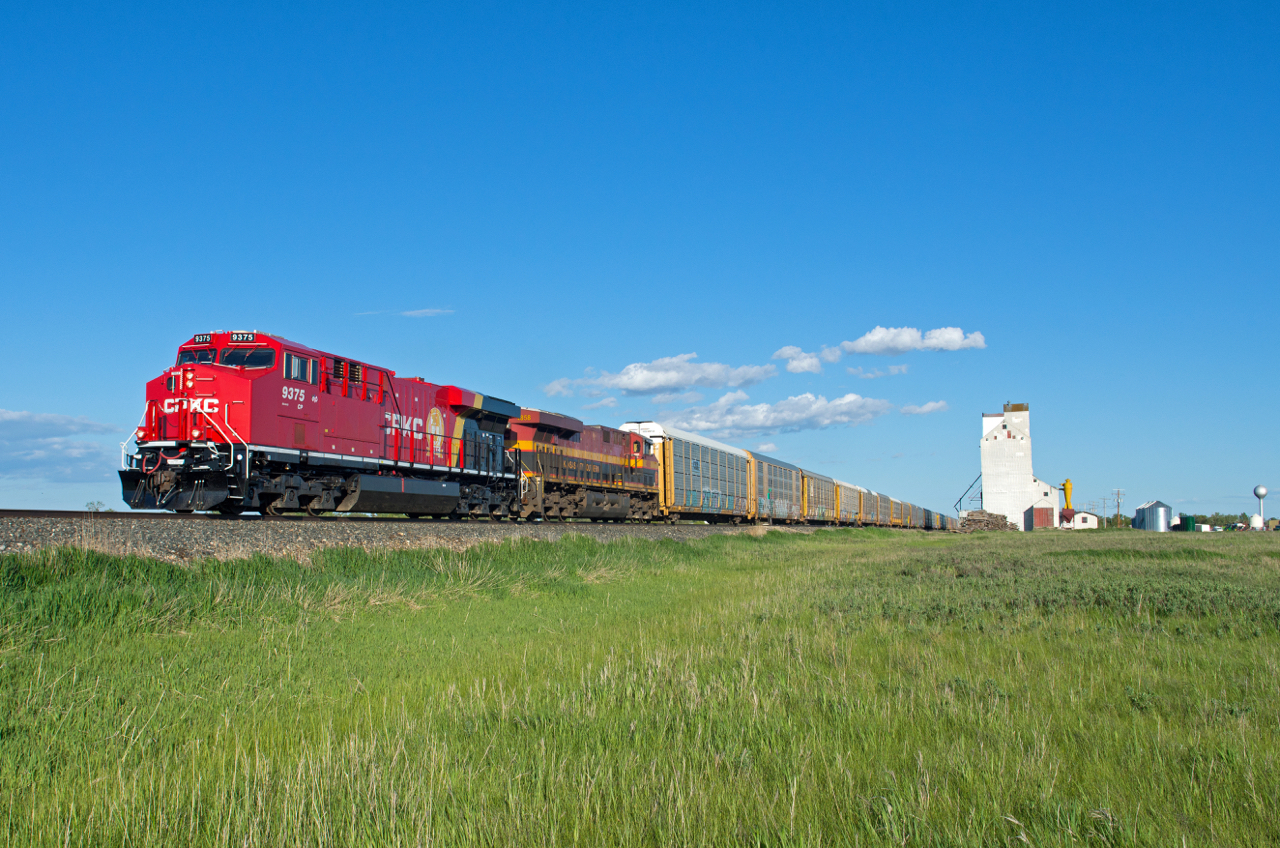 The first unit to wear the new CPKC paint scheme, CP 9375 is seen leading train 243 past the elevator at Lang SK.