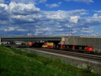 CN 401 has a pair of SD70M-2s and an ET44AC for power as it approaches Turcot Ouest.