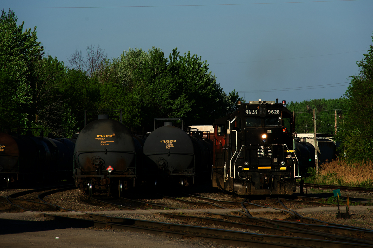 IC 9628 is leading as CN 536's light power starts to move at the start of its shift.