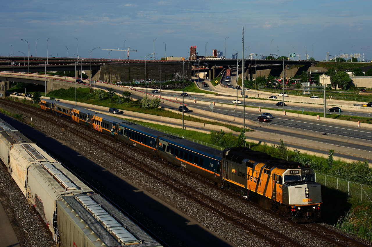 Wrapped VIA 6420 has six LRC cars in tow as it heads west.