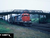 GTW GP40-2 6409 leads a solid set of GTW power on an eastbound intermodal train through Woodstock, Ontario approaching the Woodstock station. 