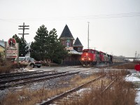 Light dusting of snow, but a rather cold morning.  Here we see CN #333 with CN 9663, 2414 and 5082 heading eastward toward Niagara Falls. The beautiful Grimsby station was now home to the RailHouse restaurant which came into being after the Grimsby Depot concept, which was a few businesses and restaurant operating out of some rolling stock west of the station, failed due to lack of customer base. The station itself would perish in an electrical fire on the last day of 1994. Not at all knowing I would relocate from St. Kitts to Grimsby some years later, I'm really glad I took the time to photograph this most picturesque location while it lasted.
