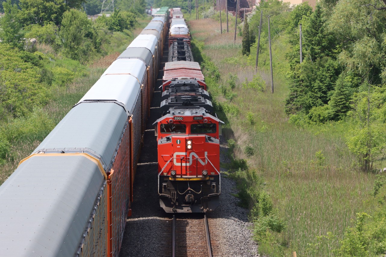 Q122 (CN 8808 CN 5721) is stopped on the north track at Tansley as westbound CN 8960 CN xxxx slides by on the south track about to duck under Dundas St. at Mile 43.7 Halton Sub..