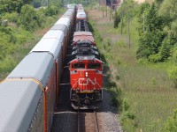 Q122 (CN 8808 CN 5721) is stopped on the north track at Tansley as westbound CN 8960 CN xxxx slides by on the south track about to duck under Dundas St. at Mile 43.7 Halton Sub.. 