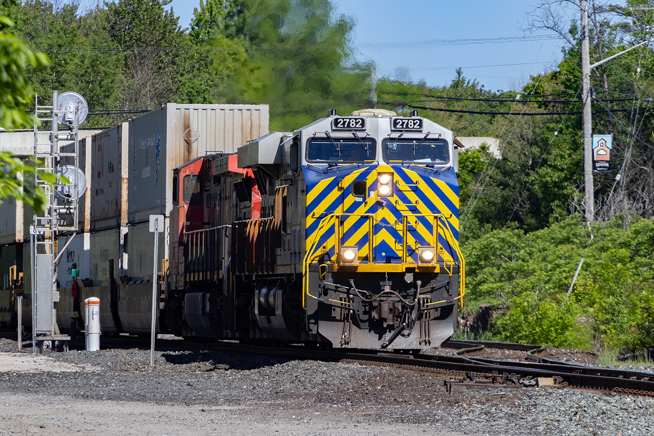 After a morning paddling around Lake Couchiching, a quick check of the northbound signal at Washago says red. Look left, and this is just coming through the switch where the Newmarket Sub joins the Bala. So much has changed here, there once being 4 tracks; 2 Bala, and 2 Newmarket. Nothing is forever.