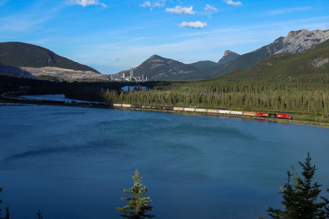 CPKC 401-14, with a matched set of newly painted CPKC units cruises through the Bow River Valley just west of Exshaw, Alberta.