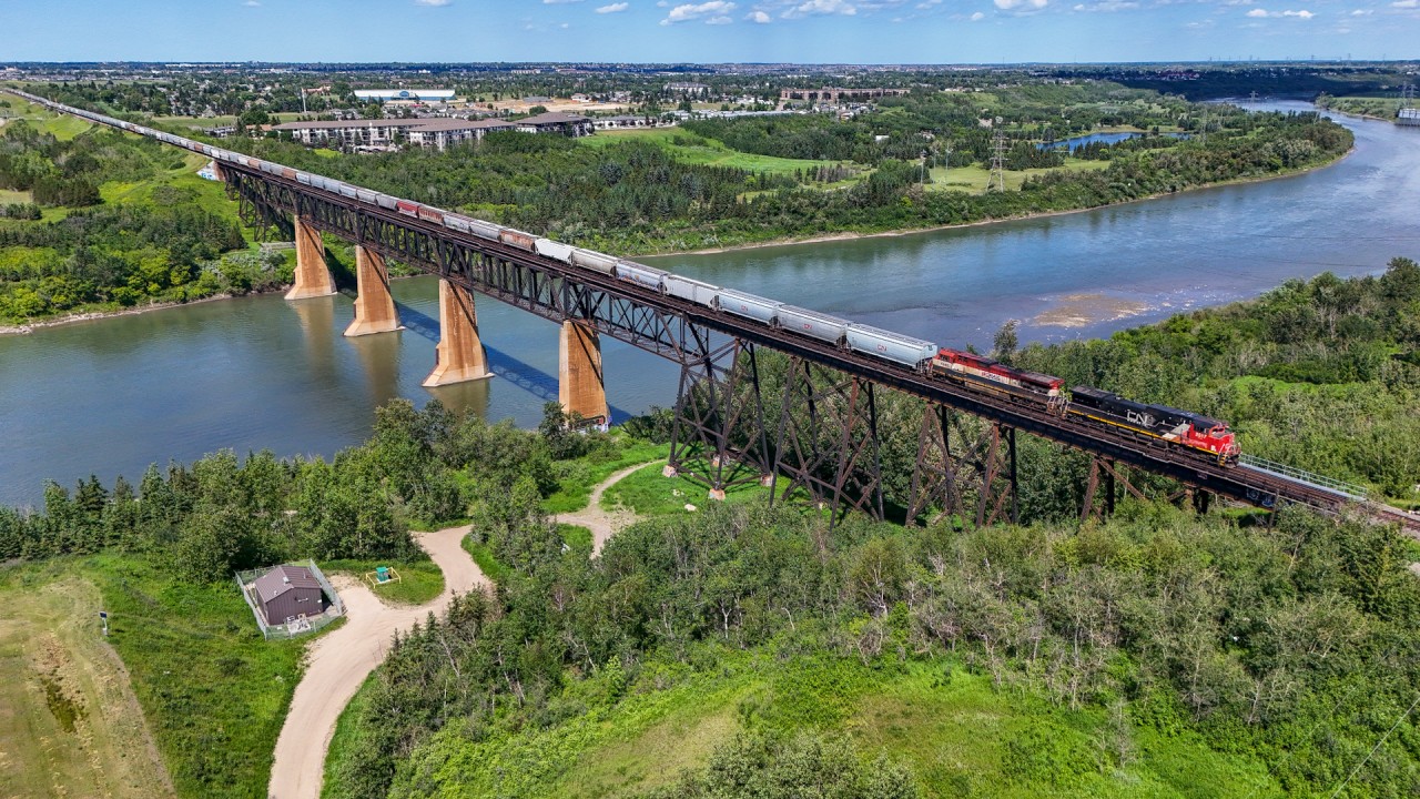 G 81451 28 rolls across the North Saskatchewan River with CN 2517 and BCOL 4642