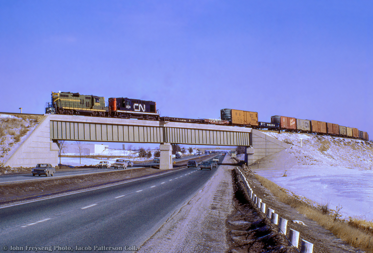 Extra 4494 west takes the curve over the 401 with traffic for CN's Toronto Yard.  A part of the Toronto bypass project during the mid 1960s, the York Sub opened just two years earlier in 1965.  See Phil Hall's 2021 photo of the bridge, expanded over the years.John Freyseng Photo, Jacob Patterson Collection Slide.