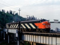 CN's eastbound <i>Super Continental</i> is a few miles out of Vancouver's Pacific Central Station as it swings east onto the Fraser River Bridge.