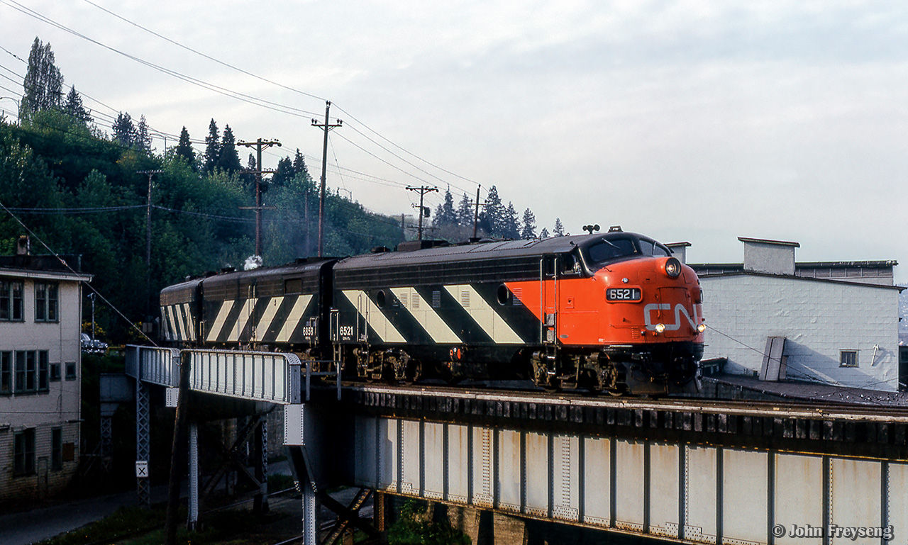 CN's eastbound Super Continental is a few miles out of Vancouver's Pacific Central Station as it swings east onto the Fraser River Bridge.