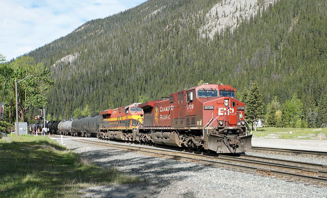 CP 9739 is backing half it's train into Field having to "double" being too long to fit Field yard.