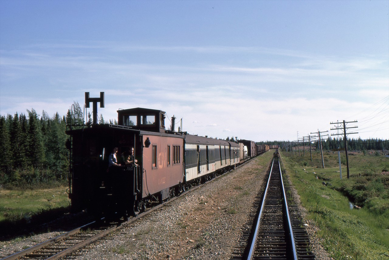 NORTHERN EXPOSURE - It was exactly 57 years ago today on June 20, 1967 that John Freyseng of Ontario travelled with four University of Toronto friends - including the late, great, James A. Brown - to celebrate Canada's Centennial by boarding Newfoundland's endangered passenger train 'Caribou' and captured some amazing narrow gauge images. During his 22-hour, 547 mile journey to the provincial capital of St. John's he photographs the unique wooden center cupola caboose on CN Mixed Train No. 203 at Northern, an isolated and lengthy siding enroute to the Gaff Topsails. With the arrival of the last batch of 20 new steel cabooses that year, the old wooden ones would soon all be taken out of service. This wonderful view from the sleeper 'Clarenville' on CN Train No. 102 on one of the longest days of the year, also shows the RPO which carried all mail across the Island. In place on 203 since being transferred from the 'Caribou' on October 5, 1958, the Railway Post Office cars would see their last run just over little than a year later on October 1, 1968. I chose this particular photo to celebrate and acknowledge this wonderful man and dear friend for capturing so many beautiful images of railway operations in 1967 Newfoundland and kindly sharing his work for others to admire. More of his breathtaking images can be seen in my latest, TRAINS OF NEWFOUNDLAND, hard and softcover editions by Flanker Press.