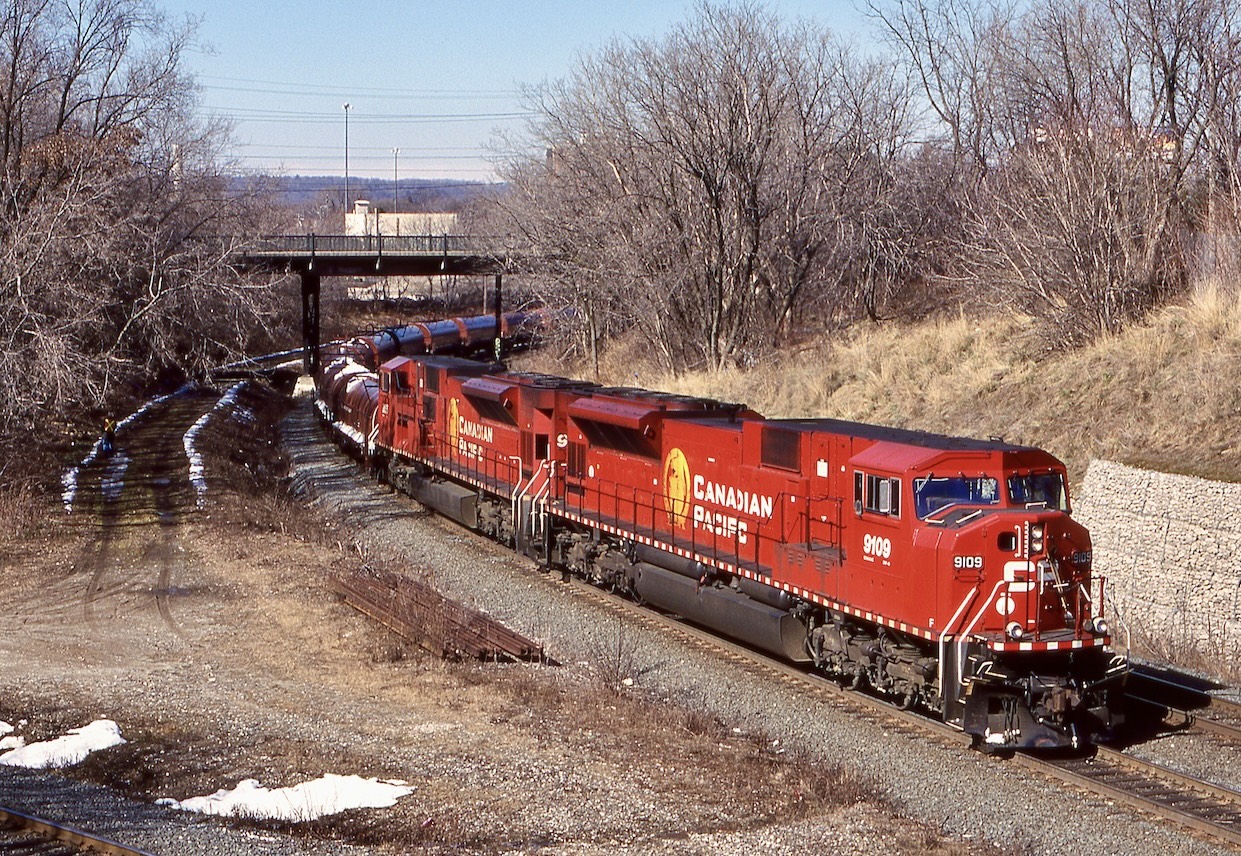 Train 222 was a decent one back in the day and for a while ran as a unit steel coil train between Sudbury and Hamilton with the rest of the trip between Sudbury and Sault St. Marie  done by Huron Central. While SD40’s and SD60’s weee the most common power on the train, I dud manage to catch a couple lash ups with SD90’s. The power also typically laid over in the old TH&B Aberdeen yard rather then Kinnear yard. Here train 222 with a pair of SD90’s has just dropped the conductor and will now pull clear of the switch at Locke before backing over the former Waterford sub. to Aberdeen yard and the trans load facility.