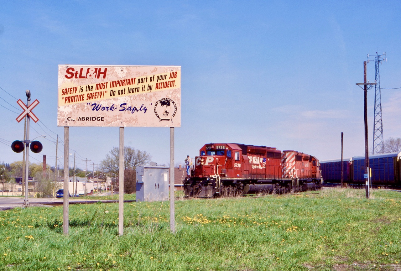 Sign of the times. The condition of the sign in Galt pretty much illustrates the  condition of the St. L&H at the time. Galt was a good place to visit back then, at a time before Wolverton was expanded. There was usually a set of units kept here for the run up to Toyota and Kitchener.  Today a number of the yard tracks have been cut while others have been removed. This day the London pick up only went as far as Galt and was using the wye. Pairs of SD40’s were the most common power for the time  and often went ignored. That would not be the case today I’m sure.