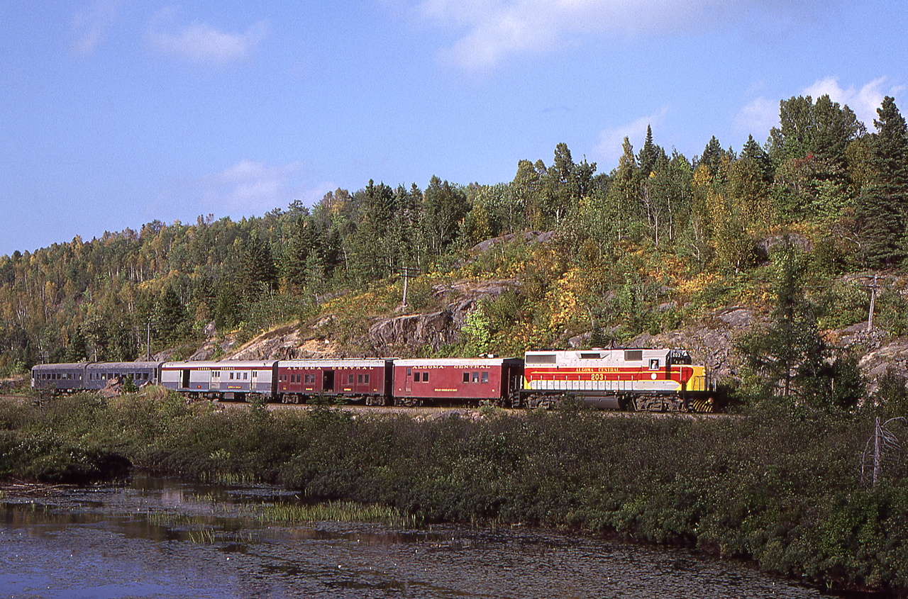 Peter Jobe photographed Algoma Central 203 with train #2 heading south at Heyden, Ontario on August 31, 1981.